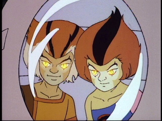 Wilykit and Wilykat in their suspension capsule, with glowing eyes